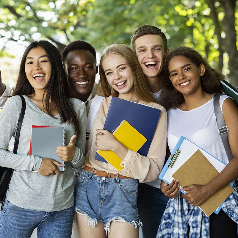 Partners4Wellness - Group of young adult holding folders in a school campus